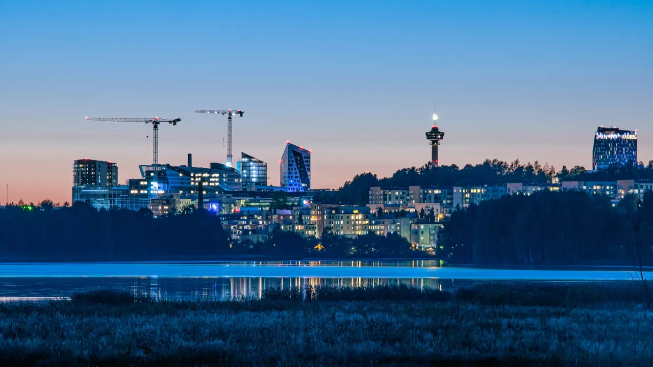 Tampere skyline across Lake Iidesjärvi during the blue hour